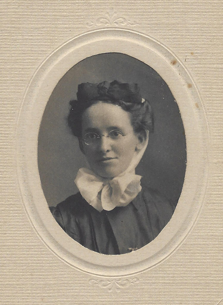 black and white portrait in oval cardboard frame